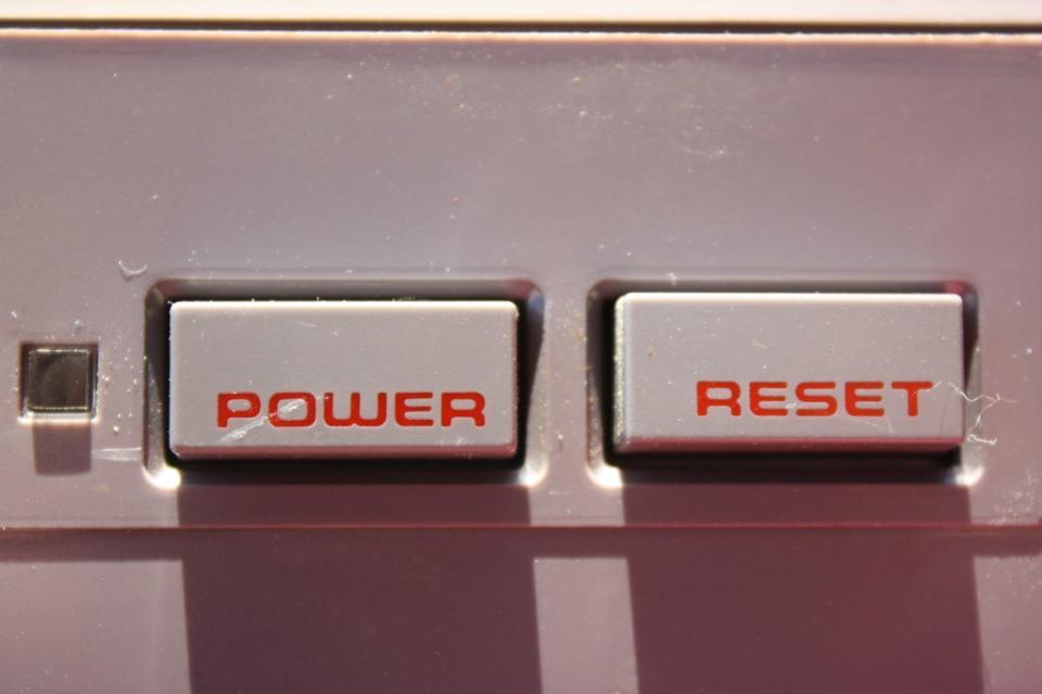 Two buttons side by side. One says "power," the other "reset"