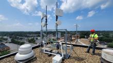 Digital C wireless array on roof with worker